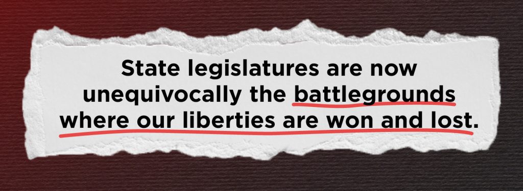 This image shows a graphic of a scrap of paper with a quote pulled from the text of the blog reading "State Legislatures are now unequivocally the battlegrounds where our liberties are won and lost." The second half of the sentence is underlined in red marker. This is over a red to black gradient background.