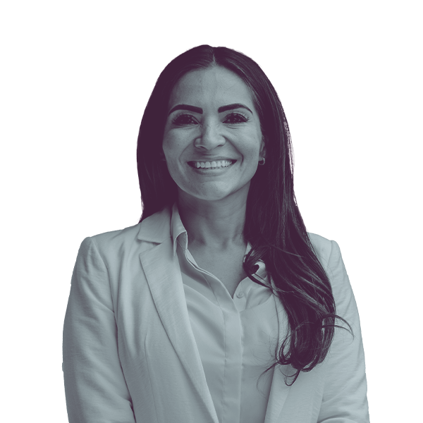 A black and white image of Sandra Jauregui of Nevada Assembly district forty-one from the waist up smiling and looking into the camera.