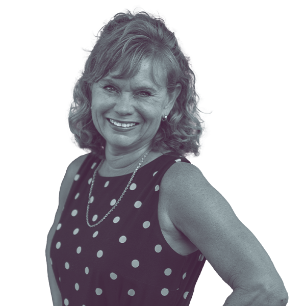 A black and white image of Christine Marsh of Arizona Senate district four from the waist up, smiling and looking into the camera.