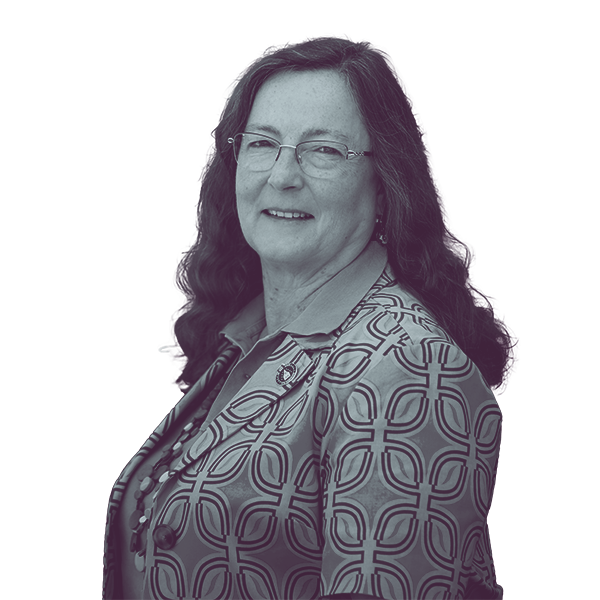 A black and white waist-up portrait of Lori Carey, candidate for New Hampshire House District Merrimack one, smiling and looking into the camera.