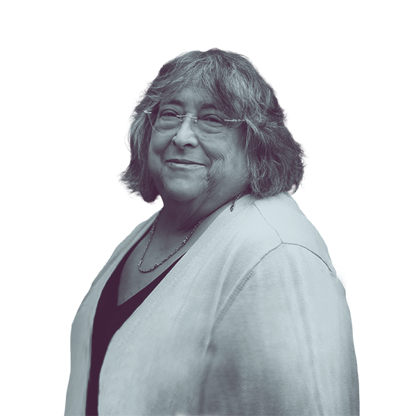 A black and white waist-up portrait of Marjorie Porter, candidate for New Hampshire House District Hillsborough thirty, smiling and looking into the camera.