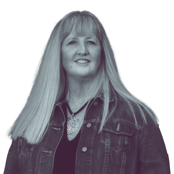 A black and white waist-up portrait of Nancy Murphy, candidate for New Hampshire House District Hillsborough twelve, smiling and looking into the camera.